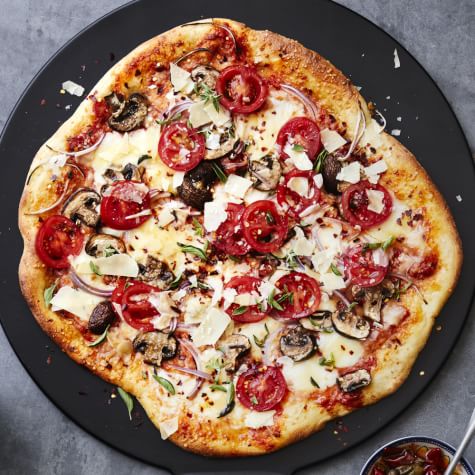 Pizza With Mushrooms Tomatoes And Red Onions